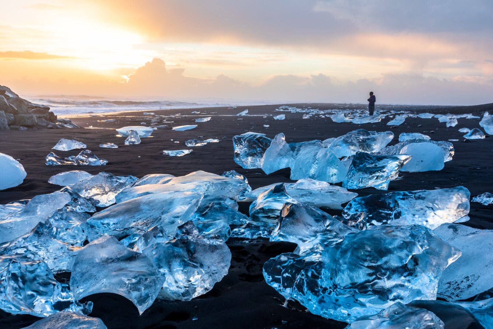 Hiker on Diamond Beach in Iceland