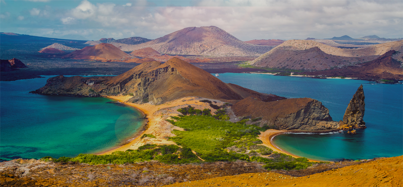 Best luxury Galapagos Cruise: View of a Galapagos charter vessel from on top of Bartolome Island