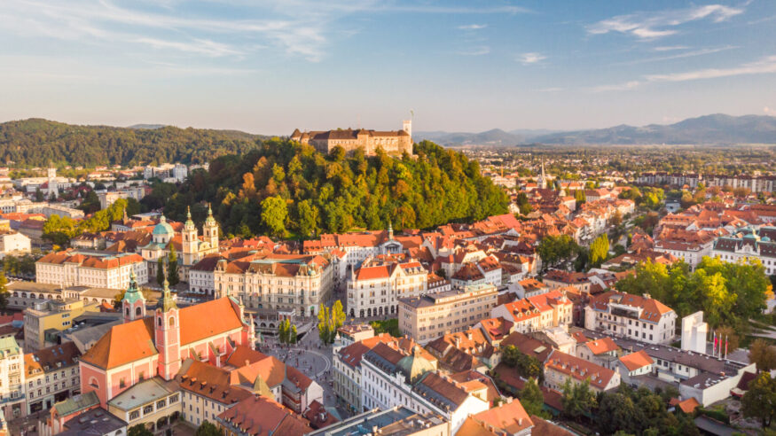Aerial panoramic view of Ljubljana, capital of Slovenia in warm afternoon sun.