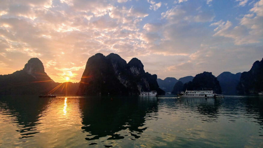 A cruise boat view of the sunrise in Ha Long Bay, Vietnam