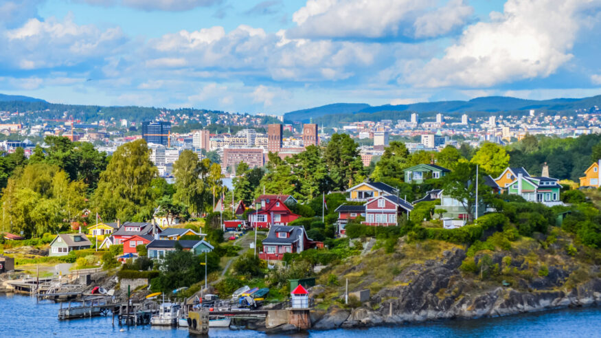 View of Oslo between city and typical nordic cottage